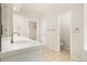 Bright bathroom featuring a sleek vanity, ample counter space, and clean, modern fixtures at 14032 E Chenango Dr, Aurora, CO 80015
