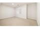 The bedroom has fresh white paint, plush carpeting, and natural light at 14032 E Chenango Dr, Aurora, CO 80015