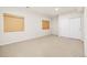 This bedroom has soft carpeting, natural light from the window, and fresh white paint at 14032 E Chenango Dr, Aurora, CO 80015