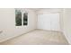 Bright bedroom featuring natural light from the window and large closet at 14032 E Chenango Dr, Aurora, CO 80015