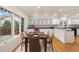 Bright dining area with ample light, hardwood floors and custom built in cabinetry at 14032 E Chenango Dr, Aurora, CO 80015