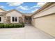 Beautiful home featuring a stone facade, attached garage, and spacious driveway at 14032 E Chenango Dr, Aurora, CO 80015