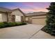 Beautiful home with stone accents, tile roof, wide driveway and attached two car garage at 14032 E Chenango Dr, Aurora, CO 80015