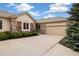 Charming one-story home with a stone facade, well-manicured landscaping, and a spacious driveway at 14032 E Chenango Dr, Aurora, CO 80015