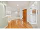 Inviting home foyer with hardwood flooring and a view of the dining and living room at 14032 E Chenango Dr, Aurora, CO 80015