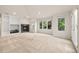 Bright living room features a cozy fireplace, custom built-ins, and natural light at 14032 E Chenango Dr, Aurora, CO 80015