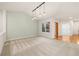 Spacious living room with vaulted ceiling, large windows, and hardwood floors at 14032 E Chenango Dr, Aurora, CO 80015