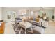 Stylish living room featuring hardwood floors, neutral walls and access to balcony at 14032 E Chenango Dr, Aurora, CO 80015