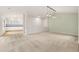 Inviting living room with carpet, neutral walls, and open access to kitchen at 14032 E Chenango Dr, Aurora, CO 80015