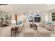 Bright and airy living room featuring a fireplace, neutral furniture, and an open floor plan at 14032 E Chenango Dr, Aurora, CO 80015