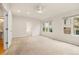 Bright primary bedroom boasts natural light and a ceiling fan at 14032 E Chenango Dr, Aurora, CO 80015