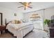 Cozy bedroom with large bed, plush carpeting, natural light, and neutral decor at 16046 E Ithaca Pl # C, Aurora, CO 80013