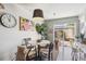 Chic dining area with modern lighting, artwork, and outdoor access, perfect for intimate meals at 16046 E Ithaca Pl # C, Aurora, CO 80013