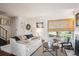 Bright and airy living room with neutral tones, a large window, and comfortable seating, great for relaxing at 16046 E Ithaca Pl # C, Aurora, CO 80013