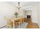 Charming dining area with a table set for four and view of the fireplace at 3695 S Kittredge St # D, Aurora, CO 80013