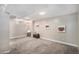 Carpeted basement with recessed lighting and unique comic-themed wall art, offering a creative and functional space at 2465 W Mosier Pl, Denver, CO 80223