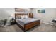 Cozy bedroom with neutral tones, plush bedding, and ample natural light at 2465 W Mosier Pl, Denver, CO 80223