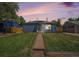Charming home with a well-manicured front lawn and inviting curb appeal at 2465 W Mosier Pl, Denver, CO 80223