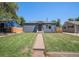 Charming single-story home with well-maintained lawn and inviting walkway at 2465 W Mosier Pl, Denver, CO 80223