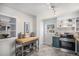 Bright kitchen with butcher block countertops and stainless steel appliances at 2465 W Mosier Pl, Denver, CO 80223