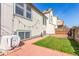 Inviting backyard featuring a brick patio, lawn space, privacy fence, and exterior view of home, perfect for relaxation at 3082 W 107Th Pl # H, Westminster, CO 80031