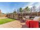 Charming backyard featuring a brick patio, green lawn, and wooden fence, perfect for outdoor living at 3082 W 107Th Pl # H, Westminster, CO 80031