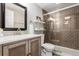Updated bathroom with tiled shower, modern vanity, and elegant mirror at 3082 W 107Th Pl # H, Westminster, CO 80031