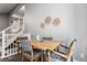 Stylish dining room with a modern table, chairs and staircase in view at 3082 W 107Th Pl # H, Westminster, CO 80031