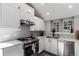 Modern kitchen with stainless steel appliances, sleek countertops, and ample cabinet space at 3082 W 107Th Pl # H, Westminster, CO 80031