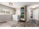 Bright laundry room with front load machines, wooden floors, and a window at 3082 W 107Th Pl # H, Westminster, CO 80031