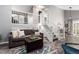 Comfortable living room featuring a sofa, stairs and stylish decor at 3082 W 107Th Pl # H, Westminster, CO 80031