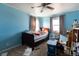 Cozy bedroom with a ceiling fan and natural light at 13654 County Road 13, Longmont, CO 80504