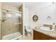 Bathroom featuring a tile shower with glass door, granite countertop, and stylish fixtures at 3532 Springbriar Dr, Castle Rock, CO 80109