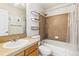 Cozy bathroom featuring tiled walls, shower over tub, and large mirror at 3532 Springbriar Dr, Castle Rock, CO 80109