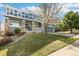 Attractive blue two-story home featuring a covered front porch and well-maintained landscaping at 3532 Springbriar Dr, Castle Rock, CO 80109