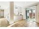 Bright living room with soaring ceilings, a fireplace, and a sliding glass door to the outdoor space at 3532 Springbriar Dr, Castle Rock, CO 80109
