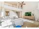 Open-concept living room with vaulted ceiling, a loft, and a view of the adjacent staircase at 3532 Springbriar Dr, Castle Rock, CO 80109