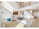 Spacious living room with a soaring ceiling, staircase, and an open floor plan perfect for entertaining at 3532 Springbriar Dr, Castle Rock, CO 80109