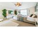 Spacious main bedroom featuring a seating area, a large bed, and abundant natural light at 3532 Springbriar Dr, Castle Rock, CO 80109