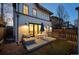 This backyard patio features an outdoor seating area, modern lighting, and sliding glass doors to the living area at 652 S Race St, Denver, CO 80209