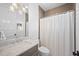 Bathroom featuring vanity with stylish tiled shower and neutral finishes at 652 S Race St, Denver, CO 80209