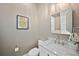 Powder room with marble countertop sink and elegant mirror at 652 S Race St, Denver, CO 80209