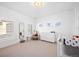 Bright Bedroom featuring neutral tones, natural light, and a cozy crib at 652 S Race St, Denver, CO 80209
