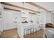 Bright kitchen featuring a large island, marble countertops, and stainless steel appliances at 652 S Race St, Denver, CO 80209