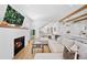 Bright living room with fireplace, hardwood floors, large sectional, and open layout at 652 S Race St, Denver, CO 80209