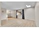 Bright living room with light hardwood floors, large window, and skylight at 903 E 7Th Ave, Broomfield, CO 80020