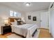 Comfortable bedroom with hardwood floors, natural light, and neutral decor for a relaxing ambiance at 500 Fulton St, Aurora, CO 80010