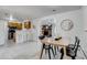 Dining room with tile floor connects to the kitchen and living room, offering an open floor plan at 500 Fulton St, Aurora, CO 80010