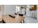 Dining room flowing into a kitchen with a breakfast bar, great for entertaining at 500 Fulton St, Aurora, CO 80010