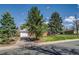 Charming single-story home with a well-maintained front yard, mature trees, and a driveway at 500 Fulton St, Aurora, CO 80010